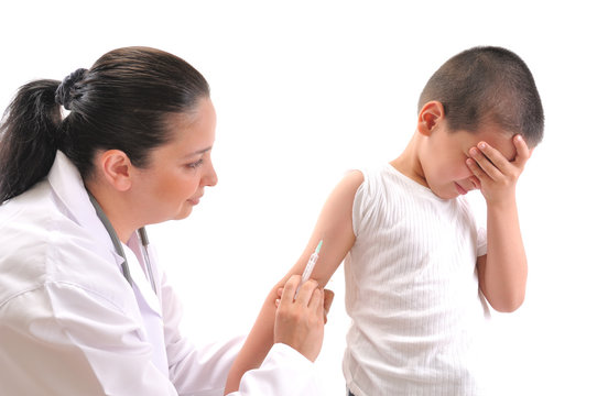 Doctor giving an injection in arm a mimmicking child.