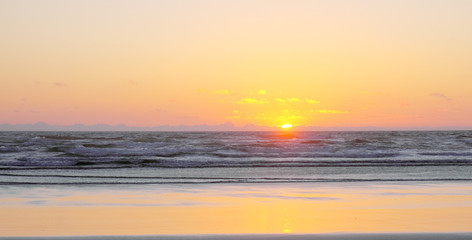 Sunset on Sandy Ocean Beach
