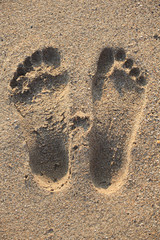 Fototapeta na wymiar Footprint in sand on beach