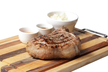 fried steak and sauces on the cutting board