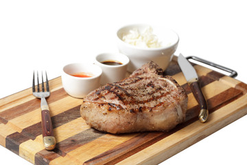 fried steak and sauces on the cutting board