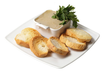 pate and crackers on a plate. isolated on a white background.