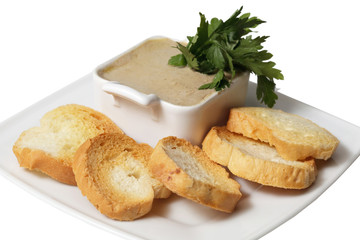 pate and crackers on a plate. isolated on a white background.
