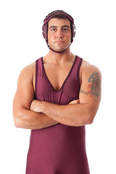 Young adult male wrestler. Studio shot over white.