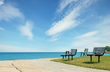 row of park benchs
