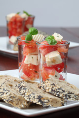Caprese appetizers with tomatoes, mozzarella and basil