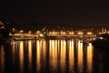 Fototapeta na wymiar The night View on bright Prague Bridge