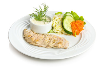 Chicken breast baked in wine with vegetable side dish.