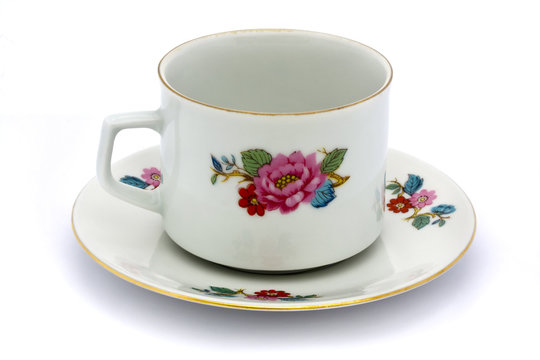 floral tea cup and saucer over white