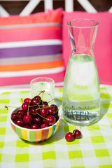 carafe water and cherries