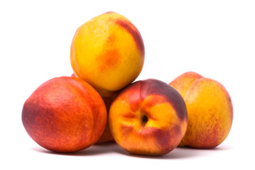 Juicy nectarines on a white background