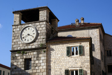 Fototapeta na wymiar Clock tower and house