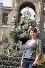 Fototapeta na wymiar Tourist poses on fountain background