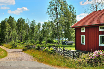 Red cottage by the lake