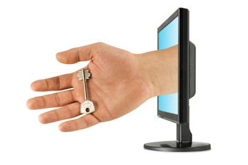 security and computer technology. key in hand with monitor