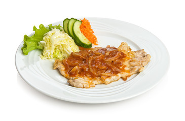 Pork with chopped fried onions and vegetable side dish