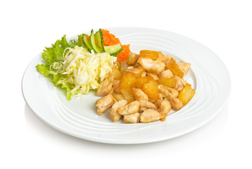 Fried chicken pineapples and vegetable side dish.