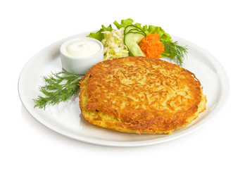 Pork fillet baked inside a potato chops, sauce and side dish.