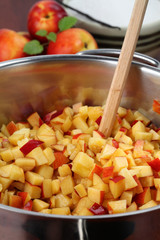 Chopped nectarines in a pot to make a delicious jam