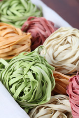 Tagliatelle pasta dyed with vegetables