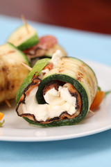Zucchini rolls with pepper crusted bacon and cheese