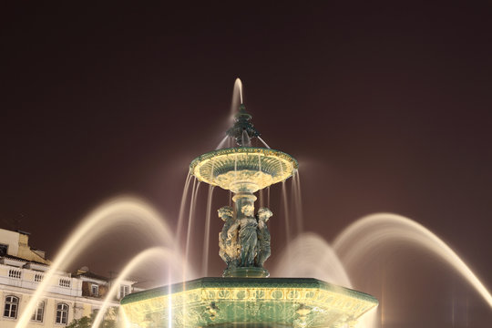 Fountain at Rossio square at night, Lisbon Portugal