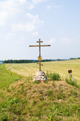 A cross is in the field