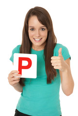 Learner driver holding L plate with thumbs up