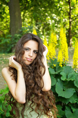 Portrait of beautiful woman with long curly hair
