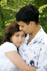 Fototapeta premium Happy young couple outdoors in park