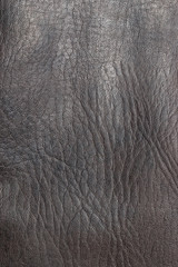 Gros plan vertical de la texture du cuir marron sans couture