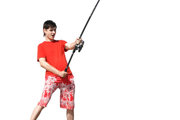 a young man in shorts and a T-shirt with a fishing rod
