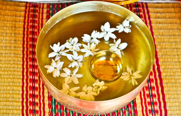 The Brass bowl of water with jasmine