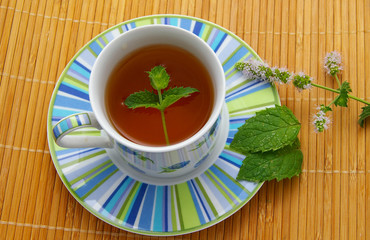 hot brewed tea, in fancy cup with mint