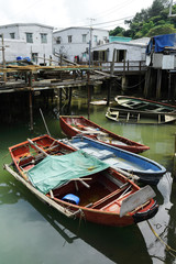 Fototapeta na wymiar Tai O fishing village with stilt house and old boat