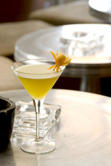 Illusion Daiquiri with orange flower in a martini-glass.