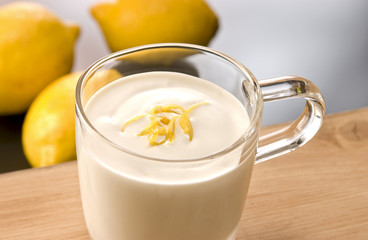 Afrococo cocktail with slices of lemom and lemon
