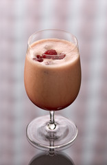 peach freeze cocktail with raspberries