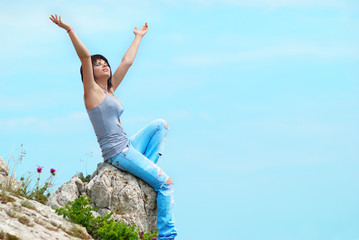 Young woman on the rock