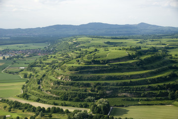 Hill with trees and other hills in the background