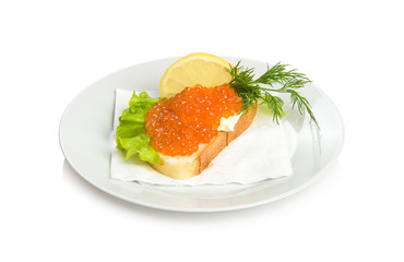 Open sandwich with red caviar, lettuce, lemon and dill