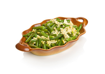 String beans with eggs in a brown bowl