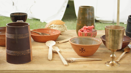 Dishes 13 th century on a wooden table