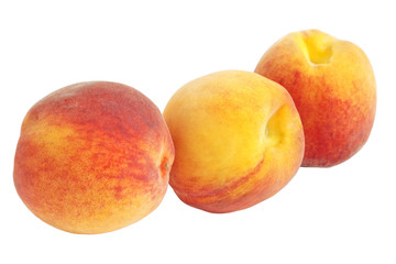Fototapeta na wymiar Closeup of three peaches isolated on white