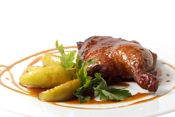 chicken with garnish on a plate. object on a white background