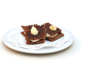 Mini tartines-russes on plate on white, shallow dof