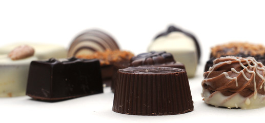 Belgian chocolates on white, shallow depth of field
