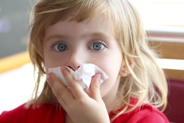 little blond girl tissue in nose