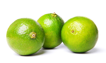 green limes isolated on white