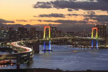 View of Tokyo downtown at night with Rainbow Bridge - obrazy, fototapety, plakaty